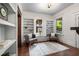 Sitting room features built-in bookshelves, wood floors, and windows showcasing the outdoors at 165 Hale Ne St, Atlanta, GA 30307