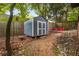 Backyard view of a wooden storage shed and outdoor seating area at 165 Hale Ne St, Atlanta, GA 30307