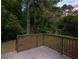 Home backyard featuring wood deck and lush green foliage at 2223 Columbia Dr, Decatur, GA 30032