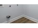 Close up of a corner of the basement featuring new vinyl flooring and white painted trim at 2223 Columbia Dr, Decatur, GA 30032