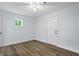 Bedroom with vinyl flooring, a window and a door at 2223 Columbia Dr, Decatur, GA 30032
