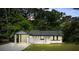 Charming white brick home with a convenient carport and well-manicured lawn at 2223 Columbia Dr, Decatur, GA 30032