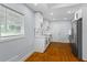 Modern kitchen with white cabinets, stone countertops, and stainless steel appliances at 2223 Columbia Dr, Decatur, GA 30032