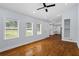 Open-concept living room with hardwood floors, recessed lighting, and a view into the kitchen at 2223 Columbia Dr, Decatur, GA 30032