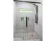 Beautiful shower featuring marble-style tile, a glass enclosure, and a modern shower head at 2223 Columbia Dr, Decatur, GA 30032