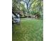Lush green backyard with mature trees, perfect for outdoor activities and relaxation at 3133 Rebecca St, Covington, GA 30014
