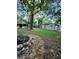 Spacious backyard featuring a fire pit, storage building and a detached structure with room for outdoor activities at 3133 Rebecca St, Covington, GA 30014