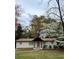 Charming single story home with white brick and mature landscaping at 3133 Rebecca St, Covington, GA 30014