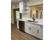 Modern kitchen featuring white cabinets, stainless steel appliances, and a stylish faucet at 3133 Rebecca St, Covington, GA 30014