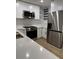 Modern kitchen with stainless steel appliances and white cabinets at 3133 Rebecca St, Covington, GA 30014