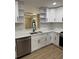 Modern kitchen with stainless steel appliances and white cabinets at 3133 Rebecca St, Covington, GA 30014