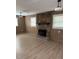 Cozy living room with stone fireplace and wood-look floors at 3133 Rebecca St, Covington, GA 30014
