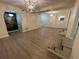 A wide open living room showing hardwood flooring and modern light fixtures at 3133 Rebecca St, Covington, GA 30014