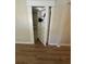 View of secret bookshelf door next to doorway in a room at 3133 Rebecca St, Covington, GA 30014