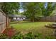Large backyard featuring a grassy area and bordered by a wooden fence at 540 Atwood Sw St, Atlanta, GA 30310