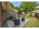 Relaxing outdoor deck and seating area with shady pergola and lush green grass at 540 Atwood Sw St, Atlanta, GA 30310