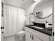 Cozy bathroom with a single vanity, granite countertop, and a shower/tub combination at 540 Atwood Sw St, Atlanta, GA 30310