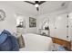 Bright bedroom featuring a ceiling fan, ensuite bathroom, and hard wood floors at 540 Atwood Sw St, Atlanta, GA 30310