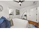 Bright bedroom with ceiling fan and hardwood floors featuring bathroom access and decor at 540 Atwood Sw St, Atlanta, GA 30310
