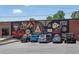 Vibrant mural in a parking lot featuring local sports and business themes at 540 Atwood Sw St, Atlanta, GA 30310