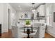 Cozy dining area with hardwood floors and ample seating, adjacent to the kitchen at 540 Atwood Sw St, Atlanta, GA 30310