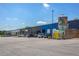 Commercial building with ample parking, exterior features, and diverse tenant spaces, ideal for business operations at 540 Atwood Sw St, Atlanta, GA 30310