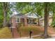 Charming brick home with a welcoming front porch and well-maintained yard at 540 Atwood Sw St, Atlanta, GA 30310