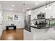 Modern kitchen with stainless steel appliances, white cabinetry, and hardwood floors at 540 Atwood Sw St, Atlanta, GA 30310