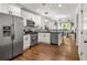 Bright kitchen with stainless steel appliances and hardwood floors open to living space at 540 Atwood Sw St, Atlanta, GA 30310