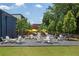 Inviting outdoor seating area with Adirondack chairs and umbrellas, perfect for relaxing and enjoying the outdoors at 540 Atwood Sw St, Atlanta, GA 30310