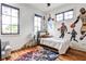 Modern bedroom with basketball-themed wall art and hardwood floors at 797 Greenwood Ne Ave, Atlanta, GA 30306