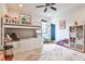 Bright, airy bedroom featuring bunk beds, a ceiling fan, and a colorful rug at 797 Greenwood Ne Ave, Atlanta, GA 30306