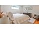 Well-lit bedroom with a comfortable bed, dresser, and decorative prints at 797 Greenwood Ne Ave, Atlanta, GA 30306