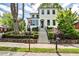 Beautiful home with manicured landscaping leading to the front door and black trimmed windows at 797 Greenwood Ne Ave, Atlanta, GA 30306