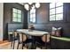 Comfortable kitchen dining nook with built-in seating, a wood table, and contemporary lighting at 797 Greenwood Ne Ave, Atlanta, GA 30306