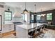 Well-appointed kitchen with a large island, modern lighting, and stainless steel appliances at 797 Greenwood Ne Ave, Atlanta, GA 30306