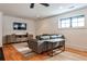 Comfortable living room featuring a plush sofa, hardwood floors, and a TV at 797 Greenwood Ne Ave, Atlanta, GA 30306