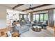 Spacious living room with wood beams, open to the kitchen, and a large sectional sofa at 797 Greenwood Ne Ave, Atlanta, GA 30306