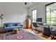 Charming living room with hardwood floors, a modern sofa, and a bright window at 797 Greenwood Ne Ave, Atlanta, GA 30306