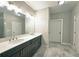 Bright bathroom features a double vanity, quartz countertops, and ample storage at 2128 Sonoma Se Dr, Smyrna, GA 30080