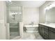 Relaxing bathroom features glass enclosed shower and standalone soaking tub at 2128 Sonoma Se Dr, Smyrna, GA 30080