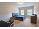 Neutral bedroom with 2 windows offers plenty of natural light and comfortable carpet at 2128 Sonoma Se Dr, Smyrna, GA 30080