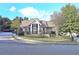 View of the brick clubhouse exterior with manicured landscaping and a welcoming entrance at 2128 Sonoma Se Dr, Smyrna, GA 30080