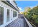 Outdoor deck with view of wooded area and sliding glass doors at 2128 Sonoma Se Dr, Smyrna, GA 30080