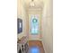 Inviting entryway featuring hardwood floors and a decorative wreath on the front door at 2128 Sonoma Se Dr, Smyrna, GA 30080