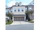 Charming townhome featuring a two-car garage and attractive architectural details at 2128 Sonoma Se Dr, Smyrna, GA 30080