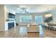 Cozy living room featuring a fireplace and large windows for ample natural light at 2128 Sonoma Se Dr, Smyrna, GA 30080