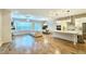 Open-concept living room and kitchen with hardwood floors and modern light fixtures at 2128 Sonoma Se Dr, Smyrna, GA 30080