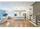 Spacious open-concept kitchen and living area with hardwood flooring and a large center island at 2128 Sonoma Se Dr, Smyrna, GA 30080