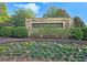 Brick sign displaying the neighborhood name, Lylebrooke, framed by colorful flowers and manicured shrubbery at 2128 Sonoma Se Dr, Smyrna, GA 30080
